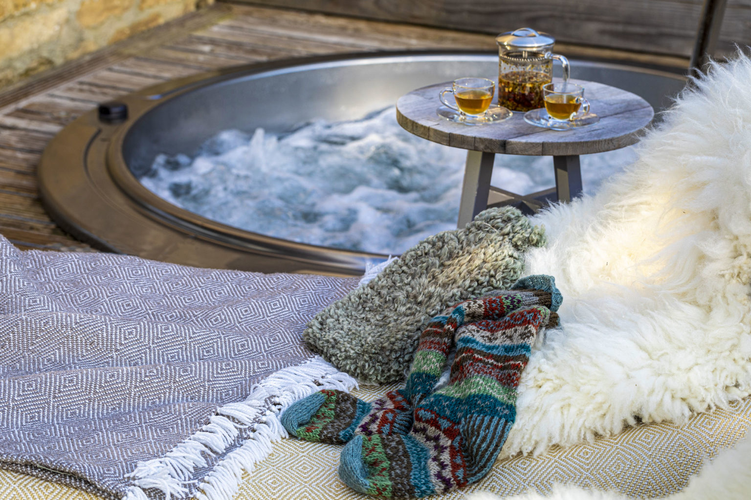 An outdoor hot tub, herbal tea and blankets at the spa in Swinton Country Club near Harrogate and Ripon