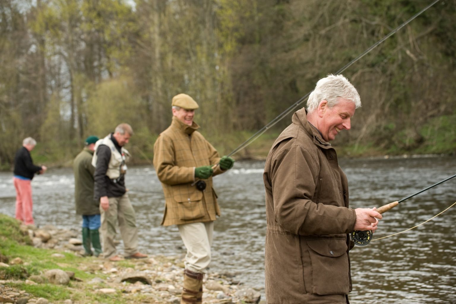 A team of people fishing on a river in North Yorkshire
