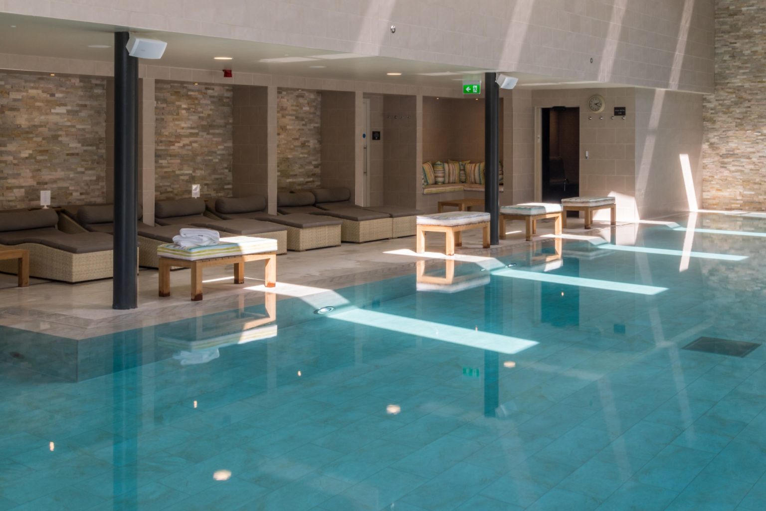 The poolside of the indoor swimming pool at Swinton Country Club and Spa in North Yorkshire