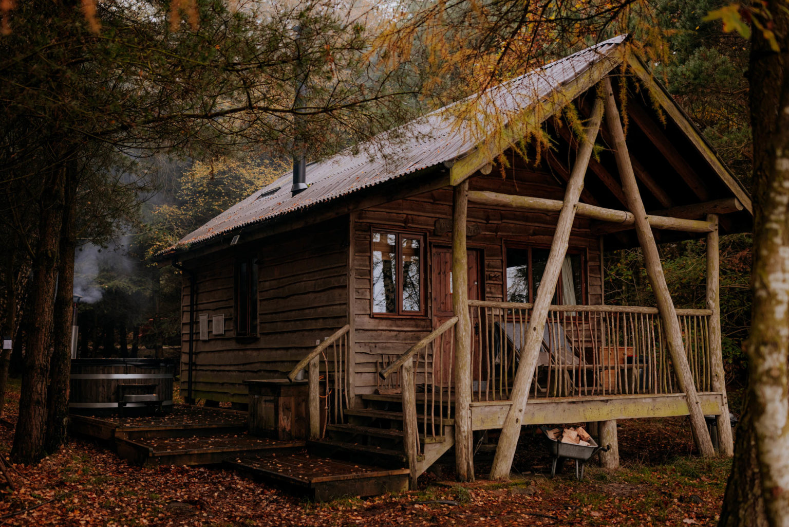 The exterior of a luxury Tree Lodge and hot tub in the woodland at Swinton Bivouac in the North Yorkshire countryside