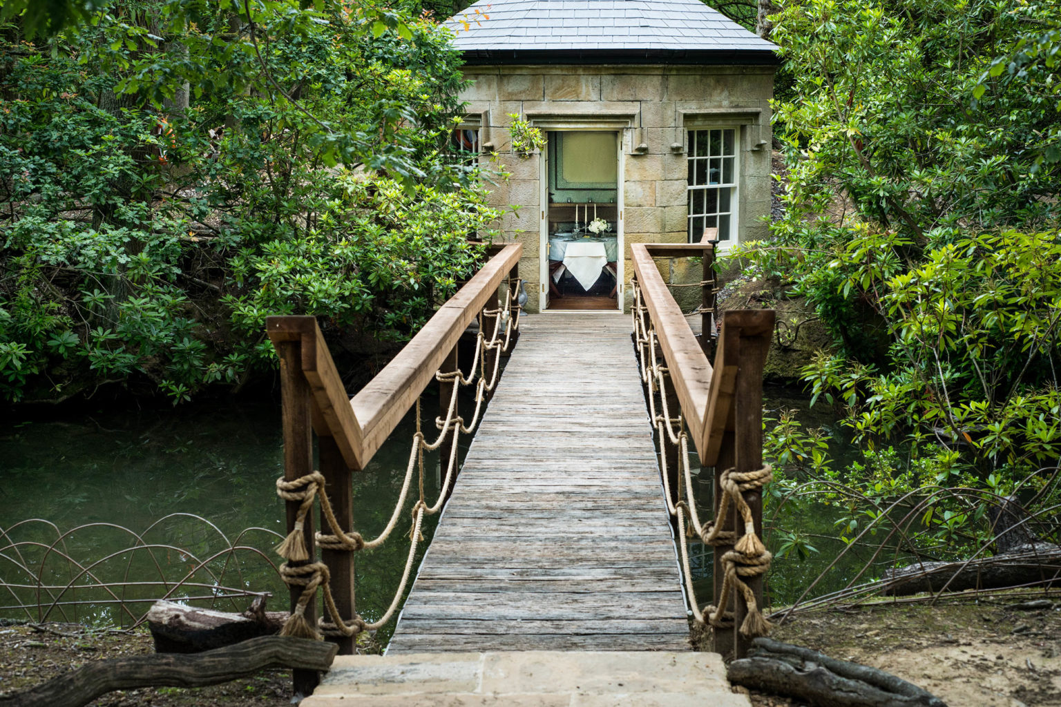 A bridge leading to the Lake House in the parklands on the Swinton Estate