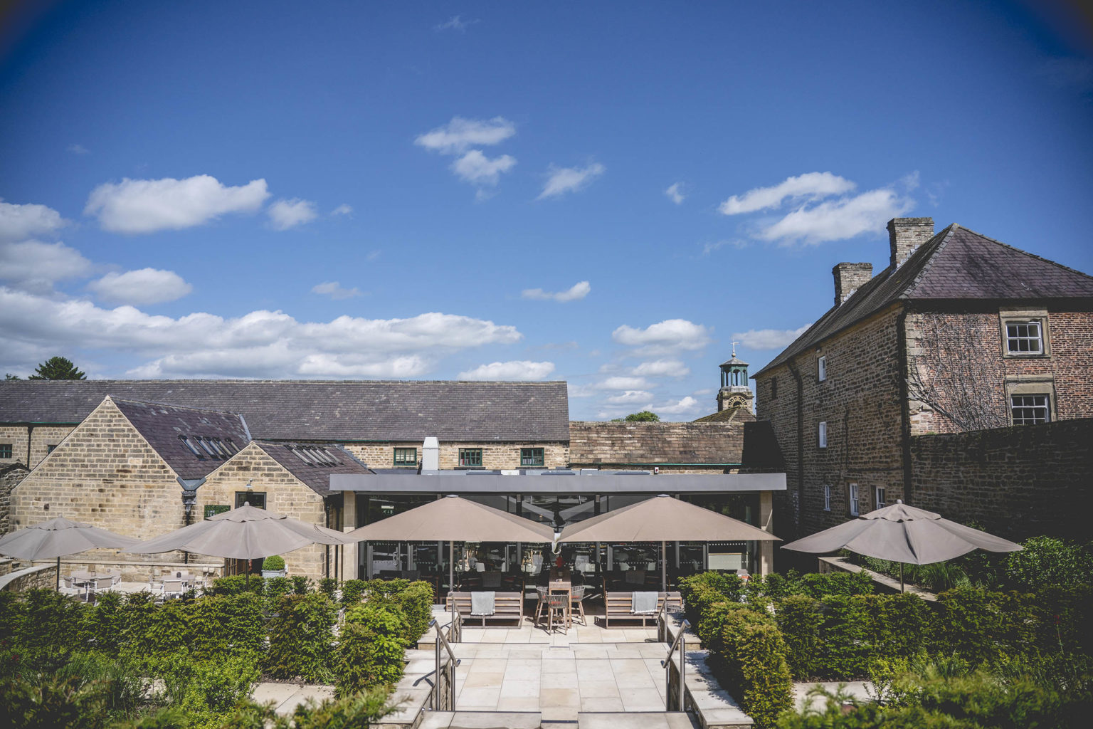 Exterior view of The Terrace Restaurant and Bar, where guests dine alfresco, on the Swinton Estate in North Yorkshire