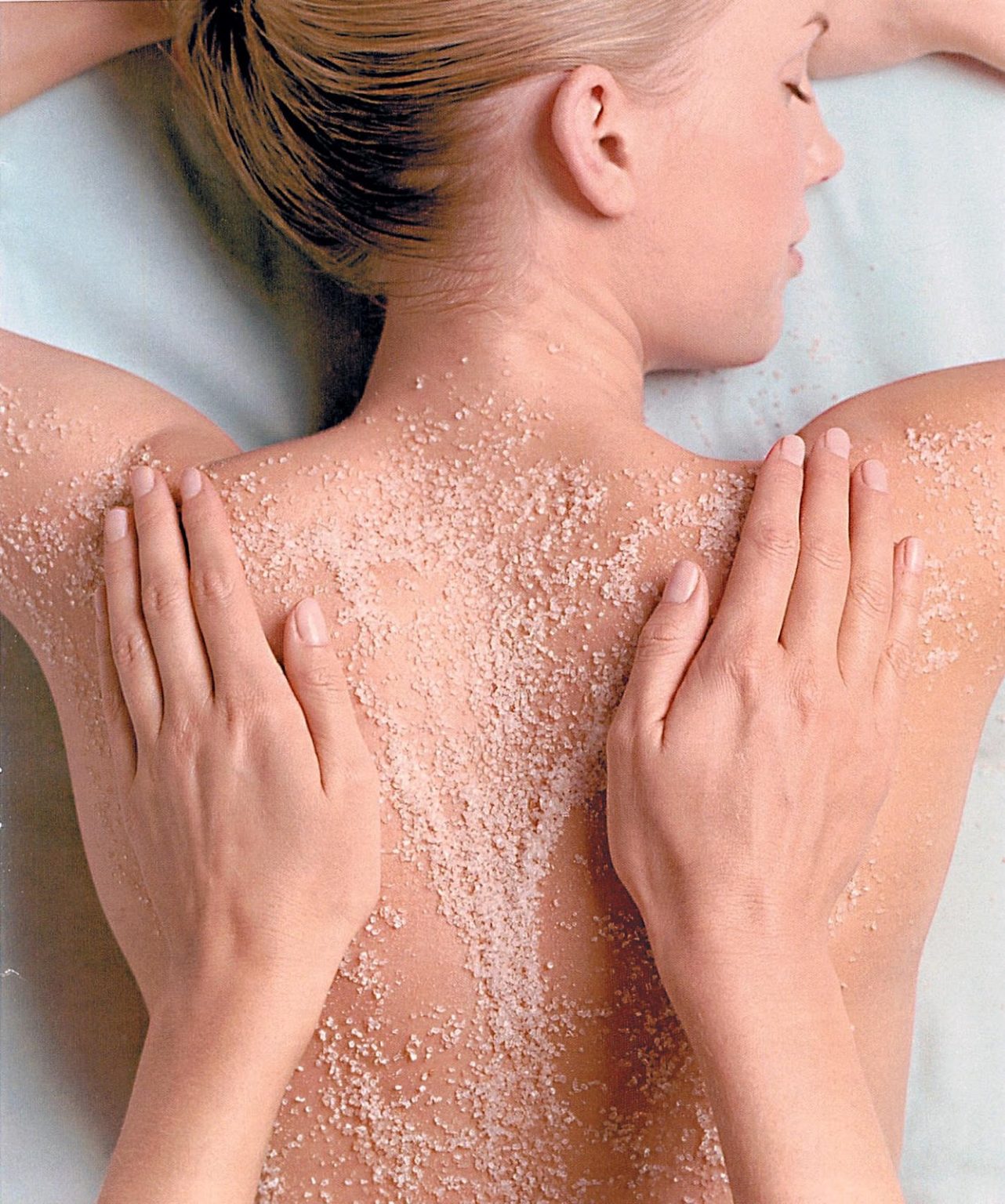 A woman having a bodyscrub during a spa day treatment
