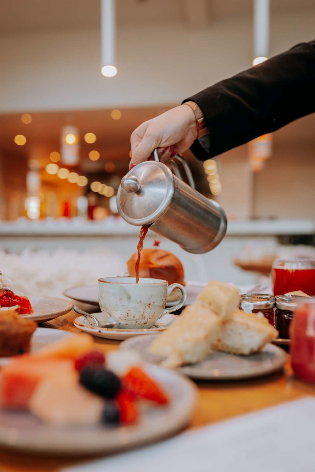 Pouring a pot of tea at The Terrace Restaurant and Bar during breakfast
