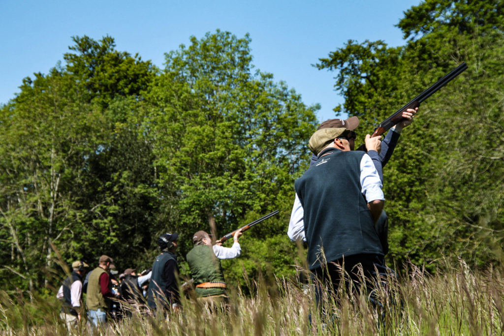 A group of people shooting clays in a simulate game shooting session on the Swinton Estate in North Yorkshire