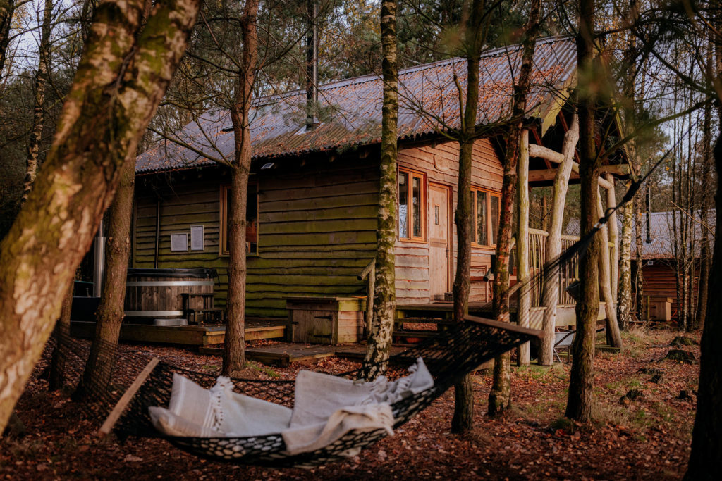The exterior of Tree Lodge accommodation in the woodland at Swinton Bivouac in North Yorkshire