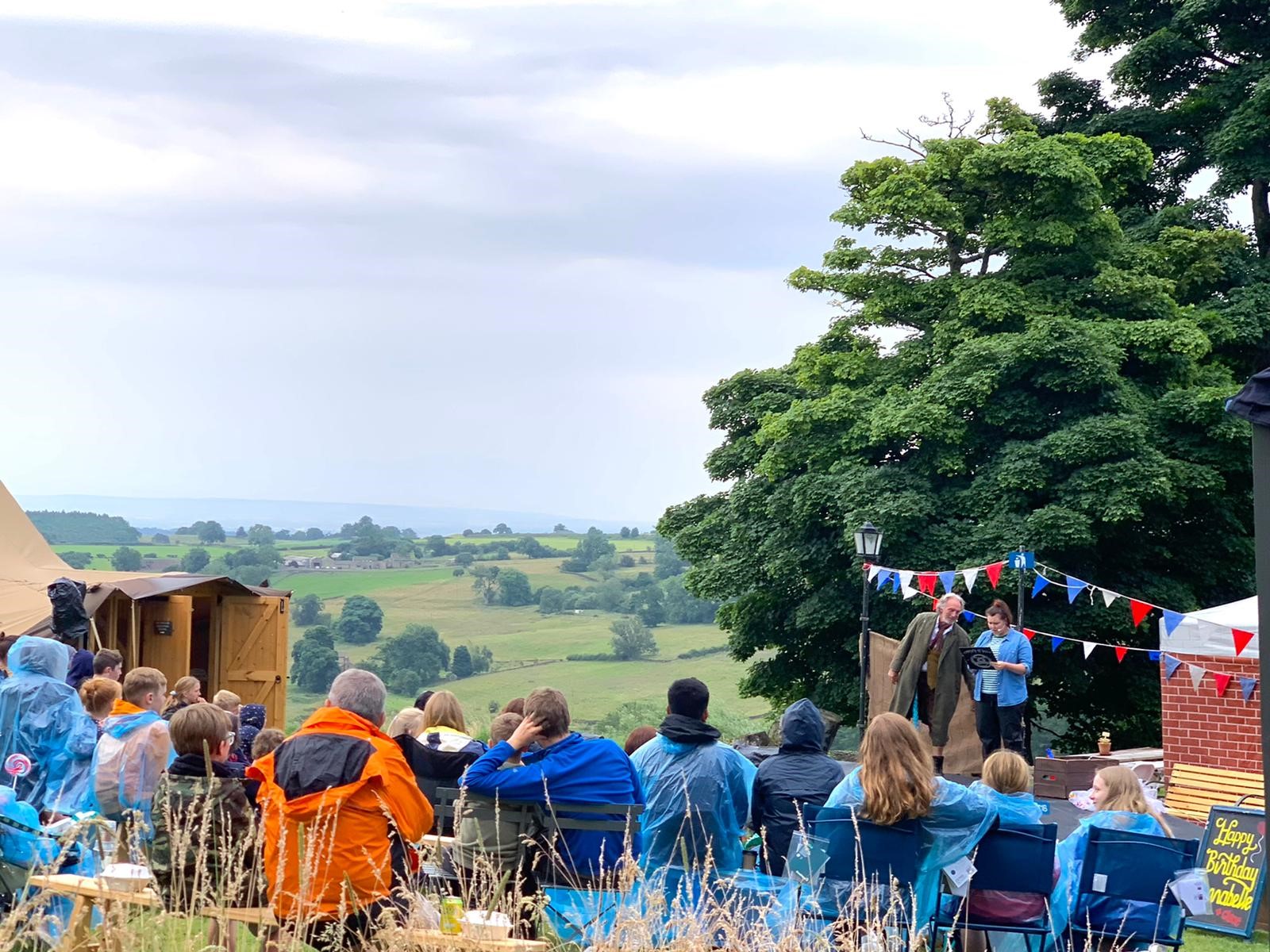 A play being performed outside at Swinton Bivouac in North Yorkshire