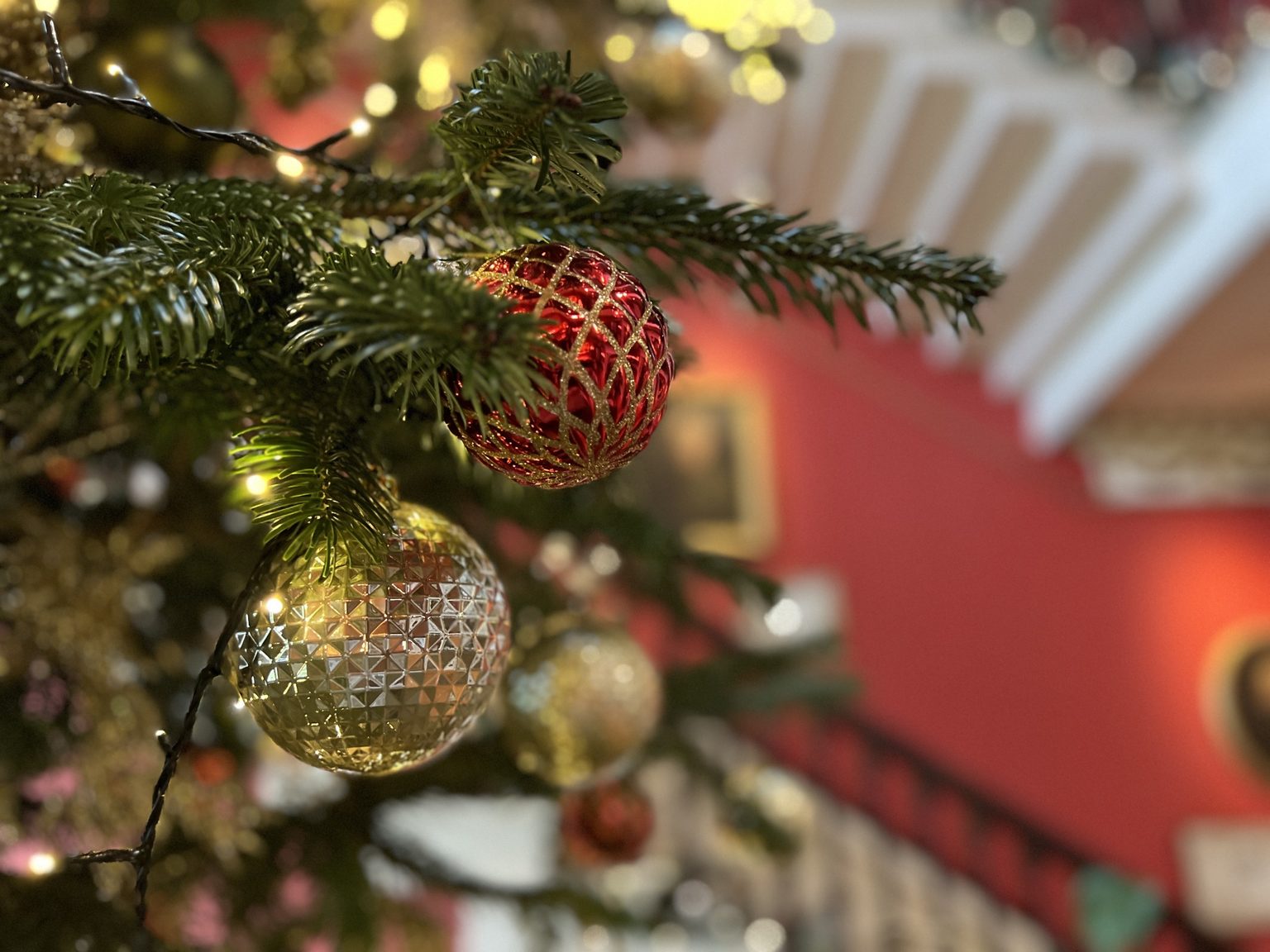 Close up photo of festive Christmas baubles on a Christmas tree at Swinton Park Hotel in North Yorkshire