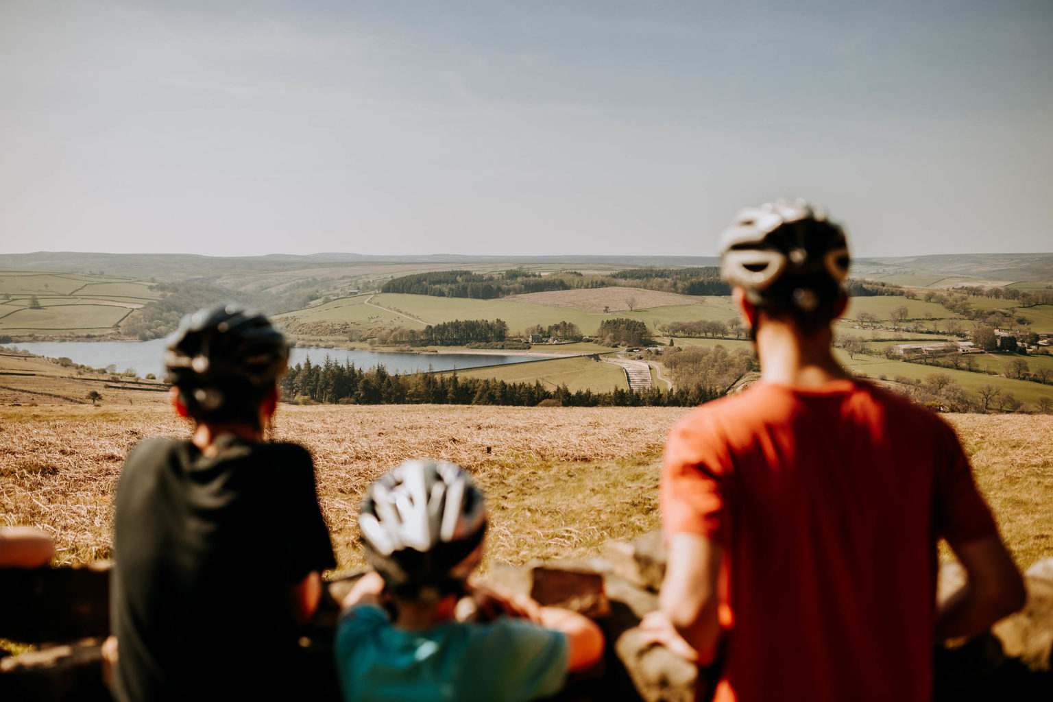 A family of cyclists look out on the beautiful Yorkshire landscape on the Swinton Estate