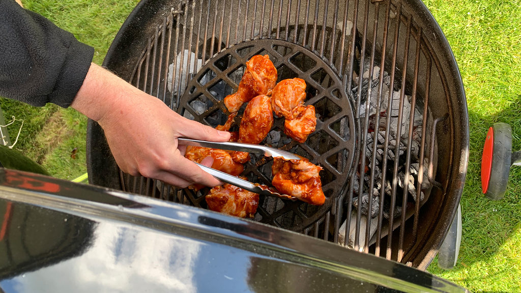 Chicken being cooked on a Weber barbeque