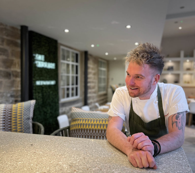 Chef Shaun Burke sitting in The Terrace Restaurant and Bar at Swinton Estate near Harrogate in North Yorkshire