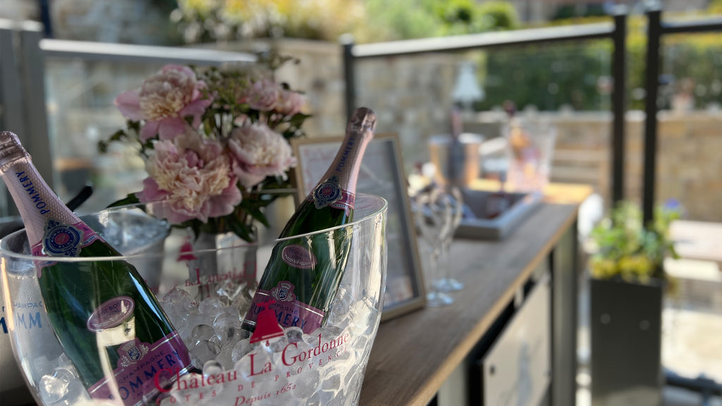 Two bottles of rose wine in an ice cooler, outside at The Terrace Restaurant and Bar's summer Rose Bar on the Swinton Estate near Harrogate