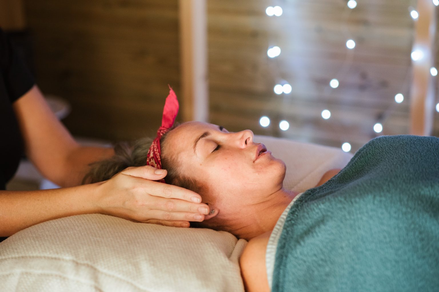 A woman receiving a holistic spa treatment